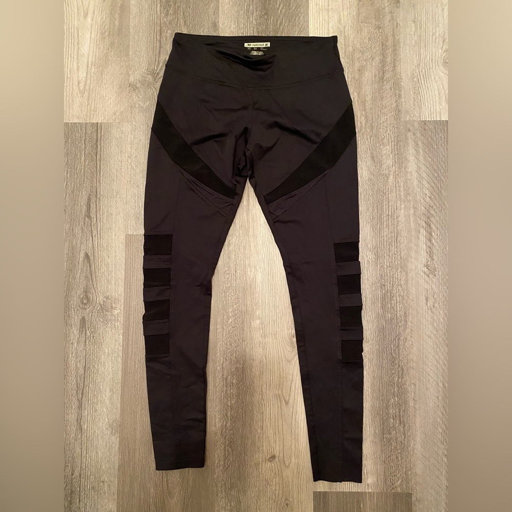 Forever 21 Black spandex S mesh panels at calf hidden pocket left front waist